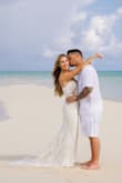 Bought for my very small beach wedding in Turks. It was perfect! Very well made for the price. It ran very long, so I had it cut and a bustle option. Highly recommend! - Kellie T.