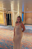 I wore this on my cruise for elegant night and I got so many compliments on this dress - and I mean so many compliments. It's beautiful, heavy, and is made very well. I got a size large but wish I would have gotten a size XL. It's out of stock now so I'm waiting for a restock and praying they do one so I can grab the XL. - Elisha B.
