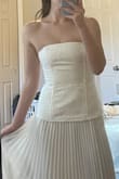 It's extremely well made for the price point! It's very flattering and classy I think. It ran slightly larger than I expected. I might have been able to fit an extra small in certain places, but you can adjust the corset back which is helpful. My one wish is that you could snatch the waist area a little bit tighter. Be aware it is quite long. I'm 5'8 and without shoes it was a couple inches on the floor. I think I'd need at least 4-inch heels to not have to hem it, but we'll see. Overall, I really recommend this dress, it's exactly like the pictures. - Eileen D.
