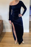 This dress is incredible! I purchased it for a winter wedding. The velvet texture & navy blue color were perfect! It's so soft, the color is super rich. I received so many compliments. I followed the size guide and ordered a large. It fit like a glove. I was very comfortable, but it fit snug like I wanted. The slit and exposed shoulder are the perfect amount of sexy. The ruching in the mid section is another great detail I loved. I'm excited to have this in my closet, but I would easily purchase this again! - Mariana C.