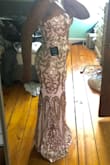 This dress is absolutely GORGEOUS! It fits perfectly, only downfall is the sequins scratched my underarms, so that's uncomfortable. I'm wearing it to a wedding in a few days and I've decided that the scratching is worth it since it's so pretty. - Maureen A.