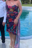 This dress is unique and fun. I got so many compliments on it! It's a very flattering fit as well. Probably my favorite dress. I would normally wear a M, but got a L in this dress, and it fits perfectly. - Gina S.