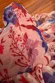 The dress is lightweight, and the color is very pretty. However, there were three issues that disappointed me. First, the dress arrived with a torn side seam. Second, the adjustable straps do not stay in place because the material is very thin and slippery. Third, the zipper feels weak and gets stuck around the waistline, and I am afraid to move it up or down because it already looks like it's going to break. Unfortunately, the dress was final sale, so there isn't much I can do at this point. - Jina N.