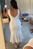 Love the fun shape of this dress. I think it would look better on me if I was taller. I bought a M and it fit well. I've decided to get a floor-length dress for my elopement, so I'm returning it. But the material is great and hangs really nicely. I would wear shapewear with it. - Tara A.