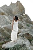 Finally found the perfect dress for my beach engagement photo. Dress hung just right on my body. The little train gives a bridal feel. Highly recommend! - Sommer P.