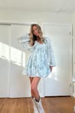 Absolutely obsessed with this dress! The fabric is lightweight and flowy with the prettiest floral print, and the puff sleeves are so flattering without feeling bulky. I ordered an XS, and it fits true to size with a relaxed, comfortable fit through the waist and hips. The V-neck is super flattering, and the length is perfect for spring and summer events. This is perfect for graduation, bridal showers, brunch, or even a casual date night. It looks way more expensive than it is and moves beautifully when you walk. I've already gotten so many compliments! - Ali R.