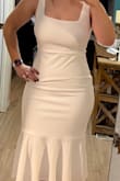 Very impressed with the quality of this dress but not "hip" friendly. At least not mine. So cute tho! And good thickness. Has a lining. - Megan O.