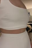This outfit is really cute, but I'm disappointed in the quality of the top. There was too much extra fabric in the top that made it fold over. Otherwise, it fits great. I wanted to re-order another size M to see if it was just a fluke, but it's out of stock. - Laura C.