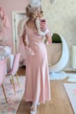 I was really surprised at the high quality of this dress. The fabric feels very luxurious and soft, and I really love the soft blush pink. It has a built-in layer underneath, but I would still recommend wearing a slip underneath. It fits me perfectly in the waist, but the bust was a little big, so I had to tweak it a little, or else the shoulder straps would slide off. Really happy with my purchase, and I would really recommend this lovely dress. - Heidi K.