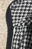 There were two patches of white on it, so it does not look brand new, and it looks defective. My hair covers it, but I like to wear my hair up, so that won't be an option. - Melany W.