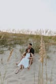 I bought this dress for my engagement pictures, and it was perfect for beach pictures! First true to size with a little stretch. Some of the reviews say it is see through, but I wore nude undergarments and had no issues - Lindsay S.