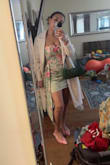 Dress is well-made. I was surprised that it was mesh; it didn't look like that on the model. I don't love mesh, but it does look okay. The colors of the flowers are very vibrant. All of the reviews were saying that it is very short. For me, this isn't the case. Maybe because I'm normally a small, but I ordered a medium because they were out of smalls at the time I purchased, and I didn't have time to wait for restock. Wearing to my cousin's bridal shower in March. Pleased with my purchase, but if I could have gotten my size, I would have, and I think I would be even happier. - Kelsey D.