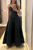 The dress is beautiful. The fabric is strong and of high quality. It runs a bit small in the bust area, and I had to have it hemmed because I'm 5'2", but I definitely recommend it. - Melissa J.