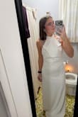 It is a stunning dress! I got it for my rehearsal dinner. I ordered a size small and had to take it to be altered. The waist down fits perfectly. I'm not sure if it is because of my height and it is made for a longer torso, or if it is because I did not fill out the chest (or both), but it was extremely large at the top. There is no way I could have worn it without alterations. You can see in the photo how much it had to be taken in. - Hannah R.