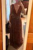The dress is so pretty & I love it. However, I ordered a S, which is my typical size from the website. I am 122 lbs, 5'5", and my cup size is a 32B/30C. If you are smaller chested and around my height, definitely size down! I returned and got an XXS small. The straps do not tighten much at all. I am much more confident that the XXS will stay secured, but would do an XXXS if possible. The waist is breathable & stretchy overall and it still gives that semi-loose fit (not too snug) even after sizing down. Lastly, being average height and wearing 1.5-inch heels, the dress is super long, but after hemming it up, it fits great length-wise. You could just wear higher heels, but my boyfriend is on the shorter side. Overall, the quality is really great, and the colors are absolutely gorgeous. I would recommend still purchasing!! 1st pic (XXS), 2nd pic (S) - Ciara A.