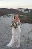 I bought this dress and knew it was the one. I love the way it looked on my special day on the beach. Amazing! - Carly O.