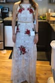 I don't have enough good things to say about this dress! I got the heels suggested in the listing and it all comes together perfectly! It may be about a half inch too long but nothing extraordinary for a long dress. I probably won't get it hemmed at all. I love that I can manipulate the space between the two pieces too, so that it can appear as one long dress or show some skin depending on when I wear it. - Laura B.