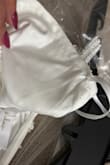 I had initially ordered a Large, and it fit well on the body, but was extremely tight in my rib cage and breast area. I could not zip it up at all, maybe halfway, and not to mention the length is too long!  I returned it for an XL, and I am in disbelief at what I received. The dress has XL written on the side with a pen! Why would they send me a dress with writing on it! I won't be using this dress. The top and rib cage area is way too loose. I can't make a return since neither of the sizes worked for me, and it was a final sale dress. So deeply disappointed. Do better, Lulus. These purchases are for special occasions, and it's quite disappointing to receive ruined dresses. - Karen G.