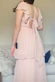 I love the look of this dress! It was a little closer to my skin color than I anticipated and the sleeves were a little loose, but that's the nice thing about the tie in the back, it makes the dress adjustable. Wearing it as a bridesmaid :) would recommend! It reminds me of the flowers God made. - Alyssa B.