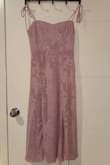 I absolutely loved this dress! I bought it for my sister's wedding shower, and it was exactly as shown in the picture. The fit was light and flowy, making it super comfortable to wear while still looking elegant. For reference, I'm 5 ft tall and about 120 lbs, and I ordered a size small and it fit perfectly. Definitely a great choice! - Rayna S.