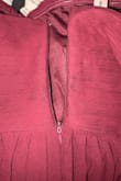 The zipper gets stuck right before the bust, even if you're not wearing it to zip it up. The front looks like it was sewn with a zigzag, so it makes your boobs look uneven. - Melissa T.