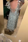 The back is really pretty, and the lace up back helps it fit better. The bust area is just designed a little weirdly. - Pamela J.
