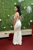 Such a beautiful dress. I ordered this for my wedding in May, and I've gotten so many compliments from my family, and even the seamstress when I went to get it hemmed a little shorter! I did buy an xs at first since it was a little too big but ended up exchanging for an xxs, and it fits SO GOOD!!!! (Also, I did buy shapewear, but it does show in the back so if you're planning on wearing shapewear, I recommend buying one that won't show in the back.) - Loreyne M.