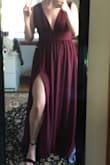 I got this dress for my prom and it is beautiful! The burgundy is more of a wine color than red but it's still very cute. It runs very long so I had mine taken in and I had the straps taken in too but even with the cost of the alterations and the dress together it was under $200 which was my price range. I recommend this dress it's super simple and flowy. - Morgan D.