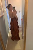 I bought this dress for a Wedding in June. It was on sale, only one size left (small), and even though I was nervous about the chest area, I said why not. Well, I'm a 34C and really need the support& For the first time ever I don't need to wear a bra!! It's crazy how great it fits. It is long, but I'm pretty petite, so I would be surprised if it wasn't. Incredible gamble that paid off! - Lucia G.