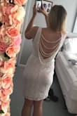 The material was great, a little see through but not cheap. The beads on the back seem a little fragile and so be careful when slipping it on and off. - Shannan R.