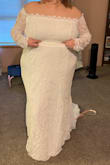 I absolutely adore 95% of this dress. I'm having a destination wedding on the beach. Just a small private ceremony. I didn't want a huge wedding dress. I love everything on this dress except the drop waist. It felt out of place and odd. I am keeping this dress and getting that altered out! Just know if you get it, it isn't the most flattering on curvier bodies. I attached a picture as is and how it is going to be with the alterations. It's a bit on the long side but otherwise the fit was perfect! - Kapri C.