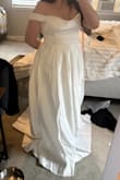 I really liked this dress. It was heavy and fit really well. I would have been able to wear it without a bra if I had picked it as my dress. I ended up going with another option, but this is still a very nice dress. I will say that if you plan to have a wedding where you are going to be dancing or having your arms up for whatever reason, the straps will get in the way. Keep that in mind. But overall, this dress is a winner, very classic and elegant.
It was a little long on me, but at 5'3 that's very normal. - Deby S.