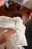 The strap was flawed straight out of the packaging. Almost deteriorated. The zipper gets stuck on a bump. It's a shame because it is beautiful, and the actual fabric is good quality. However, these details make a big difference in quality and how I feel during graduation. - Margarita F.