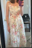 This dress is pretty cute overall. After trying it on, I decided the style wasn't formal enough for the event I'm going to, and the color doesn't look great on me. Also, the fabric has shiny embellishments, which is not what I expected, and personally, I think it looks kind of incongruous with the style of the dress. And it didn't come with a belt/bow like in the photo. - Katie W.