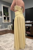 Was a little loose, and the cutout feels like it either needs to be larger or not there at all. The rouching was not falling right across the belly and looked a little baggy there, not sure if a steam would help, but it wasn't helping me feel my best as a potential bridesmaid dress. One positive is that at 5'7" I don't think I'd need a hem if I wore heels with a bit of a platform. - Melissa K.