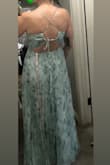 I purchased the dress as it fit the color-scheme of the wedding I'm attending and reminded me of the gorgeous Dreaming In Color dress. This dress has the same pleated details, padded cups (no bra needed!), and an adjustable tie in the back to make the bodice area fit as desired. This dress is a different fabric and has a lining under the skirt, but it is just as beautiful and comfortable. This also wasn't as long, so I won't need to hem this! I got a medium and felt that it fit true to size and fit well. I'm so excited to wear this dress! - Alexis Y.