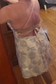 Not enough support for my mom pancake chest. Tried to add some lifting pasties, it was a no-go. The straps that tie in the back are what give it the "pull" to hold you up and I just couldn't get it tight enough. This was an immediate no for me, but unfortunately missed the return window. :-(
Even with a strapless bra, which I wouldn't be able to wear with it, you can see it does my body shape and chest no favors. - Susan B.