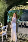 wore this dress for my rehearsal dinner! I had it altered because it was very long on me (I'm 5'5'), but after that, it fit perfectly! The beading was so gorgeous, and I love the open back, such a fun dress to commemorate such a special night! - Kjeirstin L.