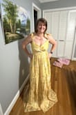 This dress fit me very well. My measurements were pretty spot on for a size large. The bust area will need to be tacked because when I turn to the side, it does come open a bit. The dress is too long for me. However, I have pretty short legs and a longer torso so this is a typical thing for my body type. The dress is beautiful. I love the slight shimmer and the fabric. - Stephanie W.