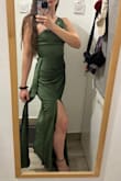 The dress is just like on stock photos, the olive green colour is beautiful in real life also. Too long for my height, but the heels will help it. It has two layers of fabric, on the outside: satin, on the inside: also polyester, but more skin-friendly, this makes the dress really comfortable. - AdÃ©l A.