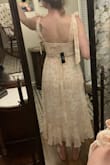 This dress fits perfectly! It's fitted at the top but comfortable. The length is perfect, and I love the slit. - Donavan W.