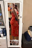 Fits like a glove! Fits your curves without showing my back rolls and stomach. It has ruffled layers, so it doesn't overly show everything. It has an elastic at the top so it doesn't slide down. My busty girls, you have to wear a bra, tape them, or a strapless bra, because it's not tight enough to secure the girls. Sizes: 5'8 210lbs 36G - Grace Z.