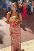 This dress is simply gorgeous! Colorful and cheerful! It is stretchy, so it seemed to run a bit large. I originally ordered size S, but I returned it. XS fit me very well and did not need to be hemmed with 3heels. Coordinated well with all the friends in the photos!! Unique look while also super classy. I got TONS of compliments! - Maya C.
