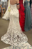 If you are even thinking about trying this dress, just order it! Maybe you won't like it, but maybe you WILL, and it will end up being your wedding dress (or your dress for another occasion). Something about this dress just made me feel so special. At first, the puffy sleeves were my favorite part, but after I got the dress altered and had the sleeves made detachable, I actually think I might prefer how it looks on me without sleeves. I am including a picture of the train to show how gorgeous it is, but I also added a bustle where I can easily pin it up, and it still looks gorgeous. I ordered a size small, and although it felt snug on top, because I am smaller chested, I had to get it altered to be tighter, along with adding padding for a bra. I also got the dress shortened as I am 5'4''. Because I am smaller chested, even with it being tightened around my chest, I think I will have to occasionally pull up the dress throughout the day when I wear it, but I am still so happy with it. Thank you, Lulus! - SARAH M.