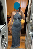 Bought this final sale so I'm keeping it, but haven't decided if I'll actually wear it in the wedding I'm a bridesmaid in. The material is stretchy (soft and velvety), so it's a comfortable fit, but it CLINGS. I feel like it hits me in all the wrong places. It definitely is an option to wear it as a V-neck, and I prefer that over the intended halter. I have small boobs but a wide rib cage. I'm 5'7 3/4, and it's long without shoes but probably would be fine with heels. - Quinlyn J.
