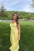 I needed a yellow dress for a wedding. This dress is a little more lemon yellow than butter, but it is a nice shade and has a striped sheen to it. It's fully lined, and I wore stickers under it. It fit me perfectly, no gapping and no alterations needed. - Zoe G.