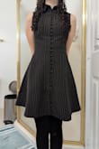 You can definitely dress this up or down. I wore it with a knit sweater and black tights. It can be a little tight on the waist while sitting for more rectangular people. I definitely will wear it again!!! - Reagan L.