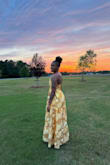 The fit of this dress was true to size for me, and the material was not heavy. I honestly felt like I was floating when I walked. The side pockets!? Omg. I loved them, and I could keep the little things that I brought with me. I received a lot of compliments about this dress, and I loved wearing it as a wedding guest for my friend's wedding. I highly recommend it - Jaelyn A.