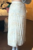I returned this because the bottom hem was super uneven. The fit was small and not flowy like I expected. - Katelyn D.