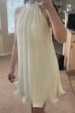 I absolutely love this dress. I bought it for my proposal shoot. It's so beautiful and flowy.
Super flattering. The material is very nice, doesn't feel cheap at all. I wore a white bra, and it's slightly visible through the fabric, but wearing a nude bra would probably suit it better. I wish the neck part fit a little tighter, but that doesn't take away from anything. I recommend a purchase!! - Sarah A.
